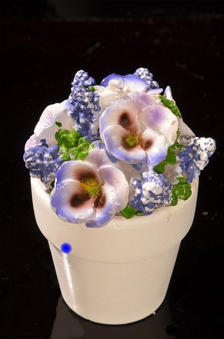 Set mit 4 Blumenkerzen in Steintöpfen